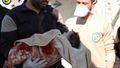 Khan Shaikhoun baby in blanket White Helmets.jpg