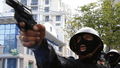 Odessa TMU pistol and cop – cropped.jpg