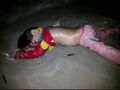 Dead refugee girl on Mediterranean beach.jpg