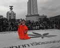 Thailand. Buddhist monk flashing the 3-finger Hunger Games salute.jpg