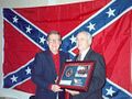 Mitch McConnell in front of the Confederate battle flag.jpg