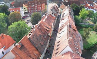 The Krämerbrücke, Erfurt, Germany, is a bridge covered entirely on either side with buildings.