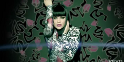 Iris during the second scene in the video for "Hearts On The Radio"
