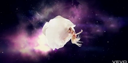 Candi floating in space in the ending scene of the video
