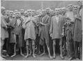 Starved prisoners, nearly dead from hunger, pose in concentration camp in Ebensee, Austria.jpg