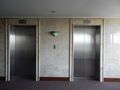 Two of the three Mitsubishi SPVF elevators from 1993 at Grand Inna Bali Beach Hotel in Bali. As of 2022 these elevators no longer exist (photo taken in 2015).