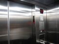 Inside a Schindler Miconic 10 elevator, with the destination indicator on the door jamb.