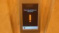 Older PORT 1 touch screen showing a warning message.