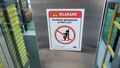 TK Elevator door warning sticker.