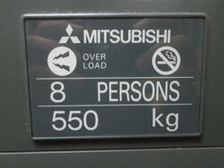 Mitsubishi GPS Elevator Capacity Badge.jpg