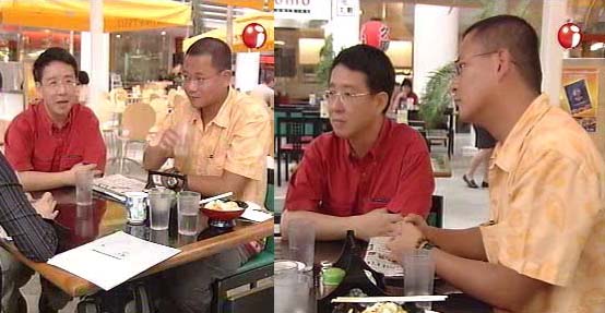Singaporean gay activists Alex Au and Kelvin Wong during a television interview on Channel i News in July 2003.