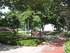 View of one of Hong Lim Park's signboards with the fountain on the right
