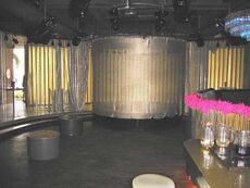 Dance floor and curtained stage in Happy.