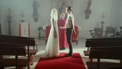 Dahlia in the video's opening wedding scene